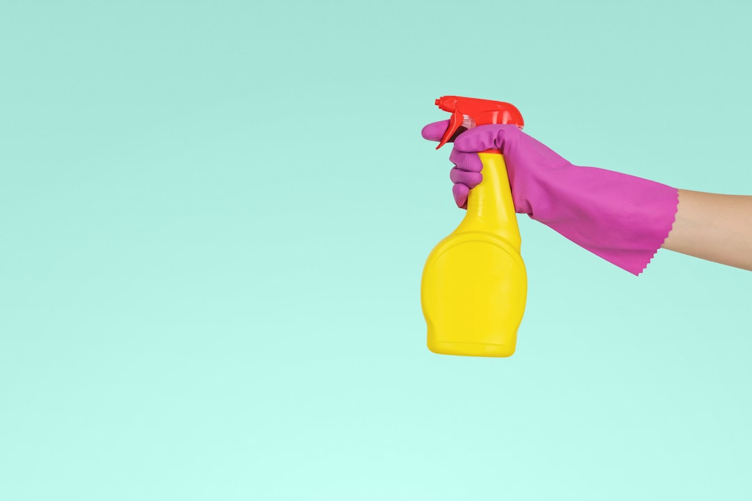 identity-01 person-holding-yellow-plastic-spray-bottle-zmnefoi3k